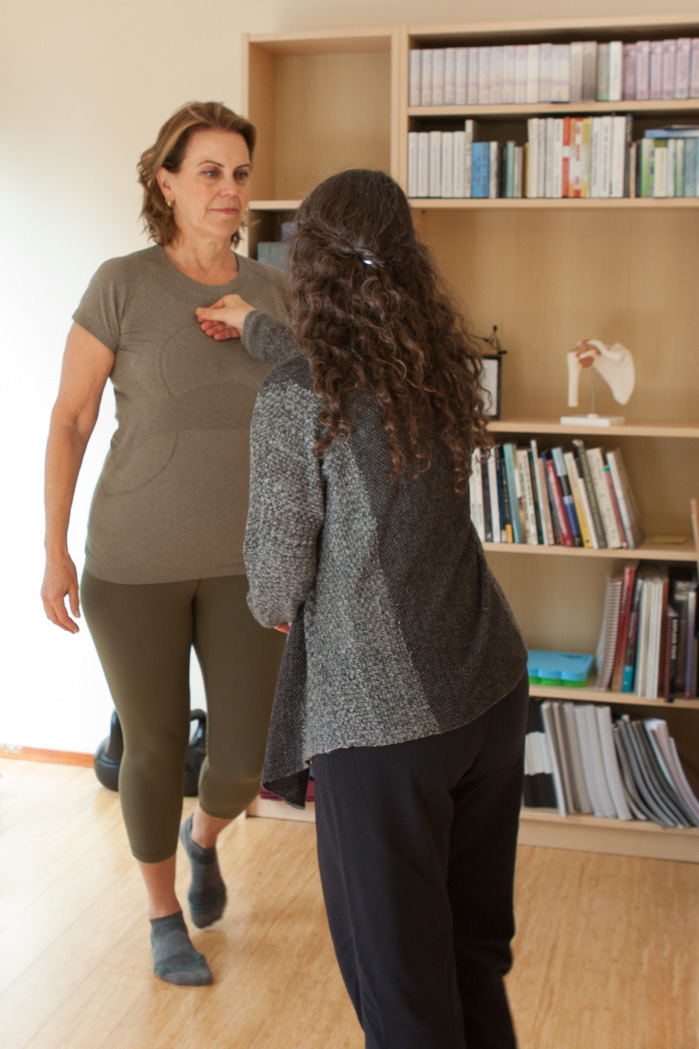 Picture2 A client walking across the studio while Laura adds light resistance from beside her.