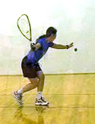 Laura Yedwab serving on a racquetball court
